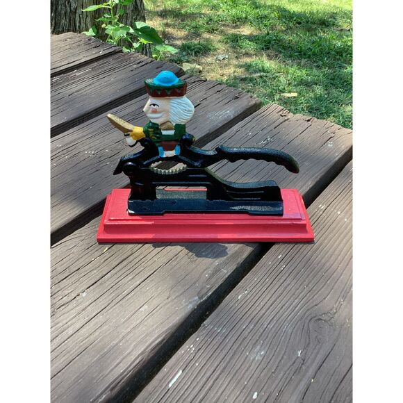 Vintage Cast Iron Nutcracker w/ Hand-Painted Nutcracker Soldier on Red Base - Picture 1 of 4